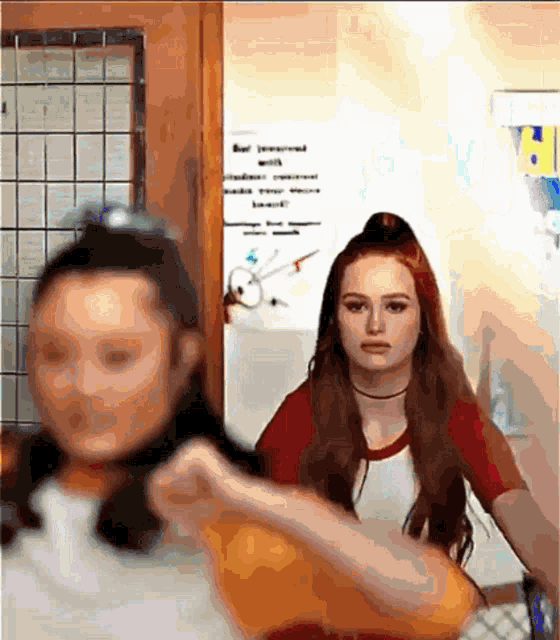 two girls are standing next to each other in front of a sign that says " be prepared with "