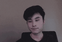 a blurry picture of a person standing in front of a computer .