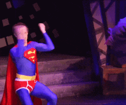 a man in a blue and red superman costume