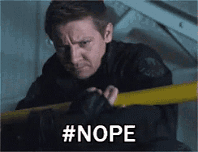 a man in a black jacket is holding a yellow pole and says nope