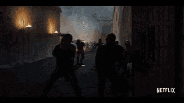 a netflix ad shows a man holding a sword in a dark alleyway