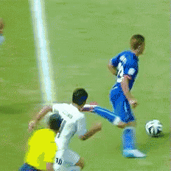 a soccer player with the number 14 on their jersey