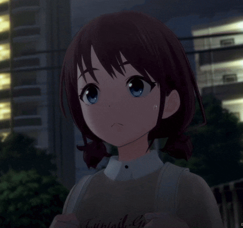 a girl with brown hair and blue eyes is looking at the camera with an angry look on her face