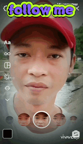a man wearing a red hat with the words follow me above his face