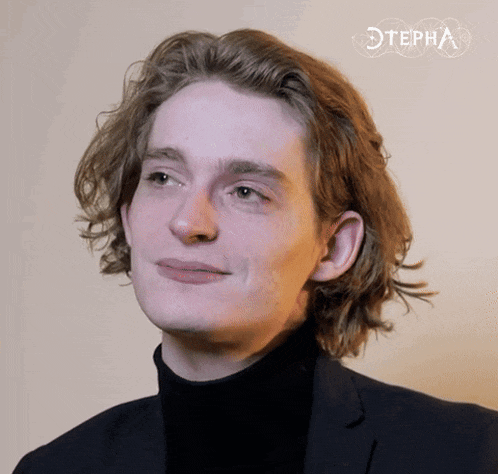 a close up of a young man 's face with the word stepha behind him