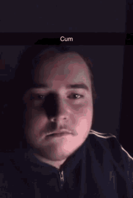 a man drinking a glass of milk with the word cum on the bottom right