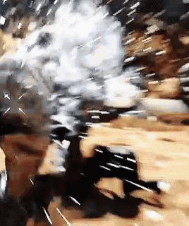 a blurred image of a person holding a gun