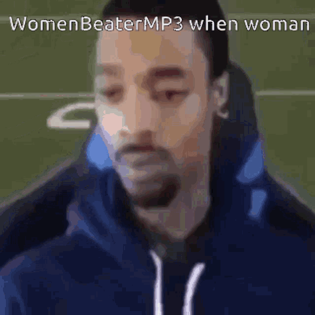 a blurry picture of a man with the caption womenbeatermp3