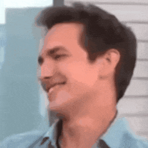 a close up of a man 's face with a blurry background .