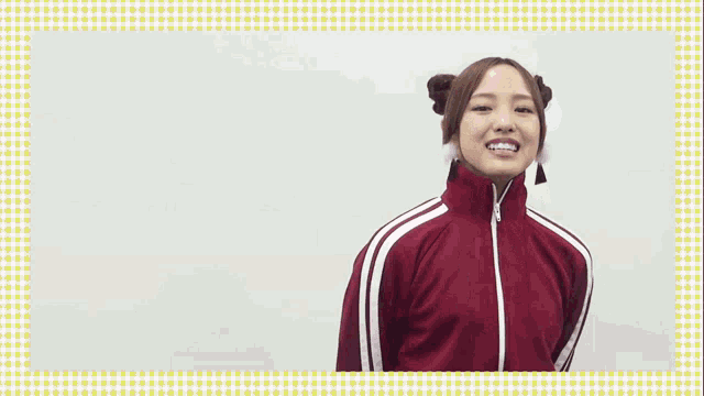 a woman in a red jacket with white stripes on the sleeves