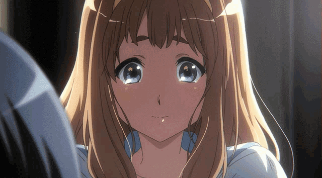 a close up of a girl 's face with a blue eye