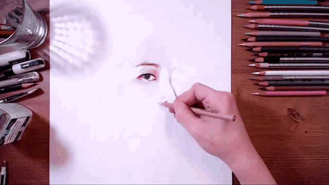 a person is drawing a woman 's face with a pencil that says ' uni ' on it