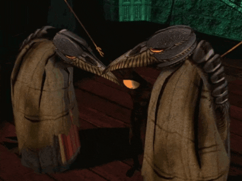 two birds are standing next to each other and one has a long beak