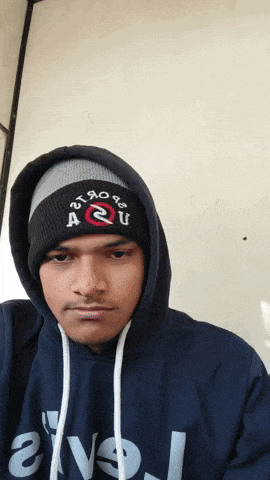 a man wearing a hoodie and a beanie with a2u embroidered on it