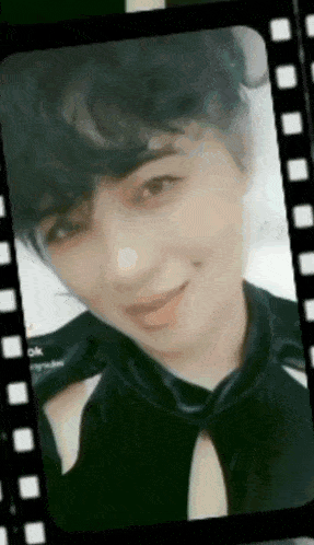 a close up of a woman 's face in a film strip