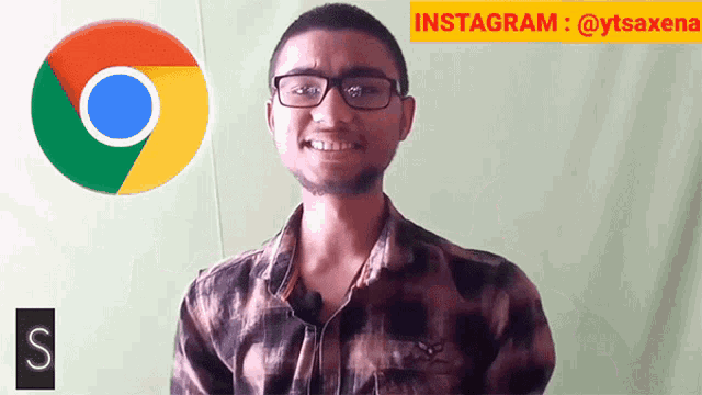 a man with glasses is smiling in front of a google chrome logo