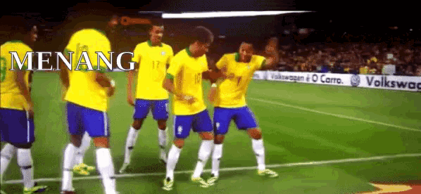 a group of soccer players on a field with the word menang on the bottom right