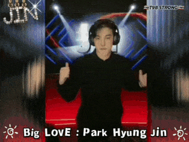 a man wearing headphones with the words big love park hyung jin behind him