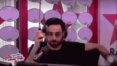 a man wearing headphones is talking into a microphone in front of speech bubbles that say camille combat virgin tonic italia