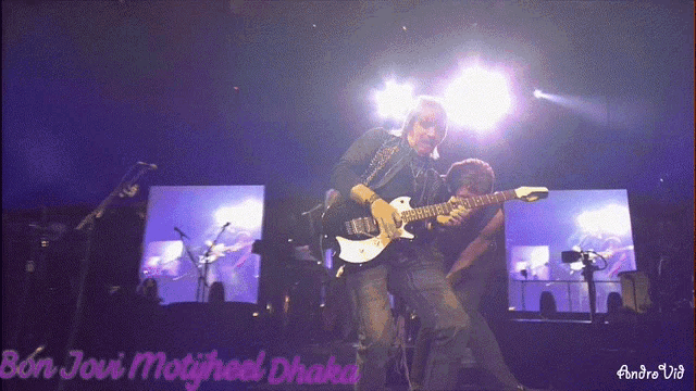 two men playing guitars on a stage with the words bon jovi motyheel chaka written on the bottom