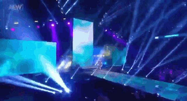 a stage with a lot of lights and the word aew in the corner