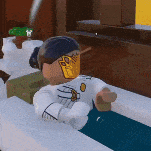 a lego character is taking a bath in a bathtub
