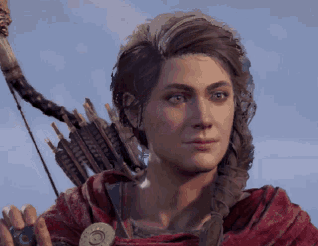 a close up of a woman holding a bow and arrow in her hand
