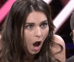 a woman with a surprised look on her face