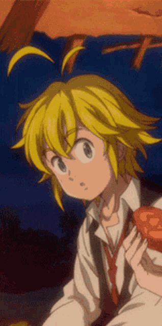 a boy with blonde hair and blue eyes is holding a red apple in his hand