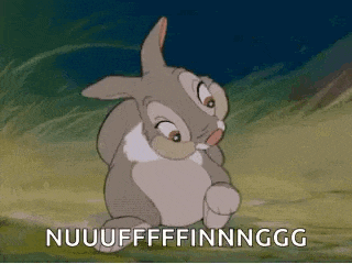 a cartoon rabbit is sitting in the grass with the words nuuuffffinnngg written on it .