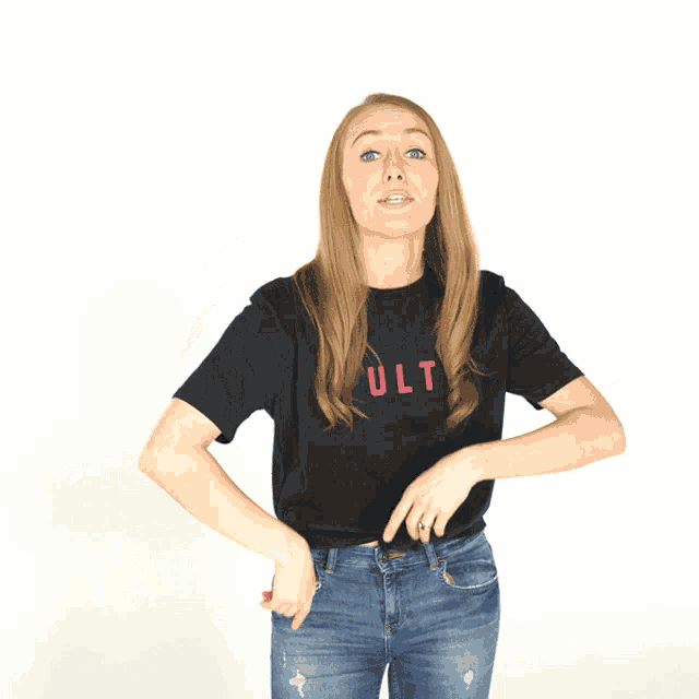 a woman wearing a black t-shirt with the word ult on it