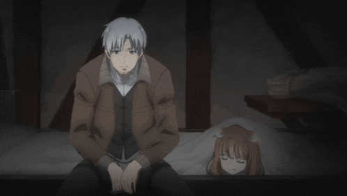 a man standing next to a girl laying in bed