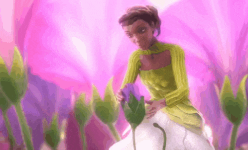 a woman in a green dress is standing in a field of purple flowers