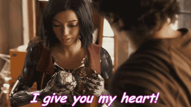 a woman in a latex suit is holding a statue and says " i give you my heart "