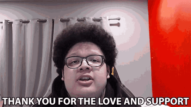 a man wearing glasses is saying thank you for the love and support