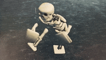a skeleton with a gun in its mouth is laying on the floor