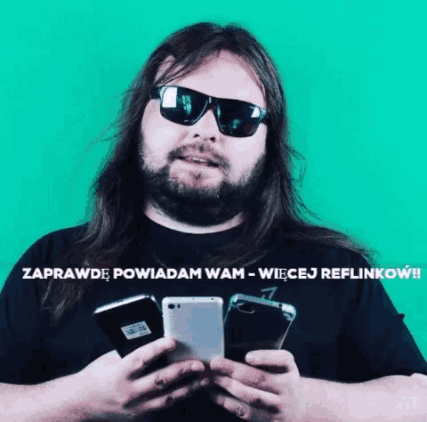 a man with long hair and a beard wearing sunglasses holds two cell phones