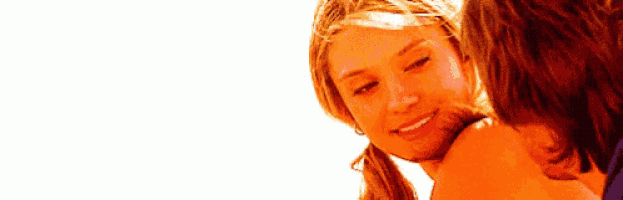 a man and a woman are looking at each other with a white background .