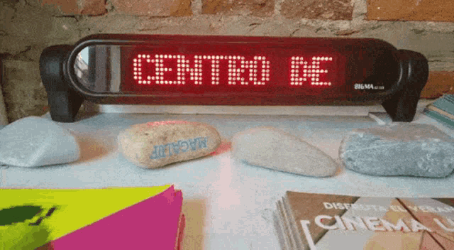 a red sign that says centro de is on a table