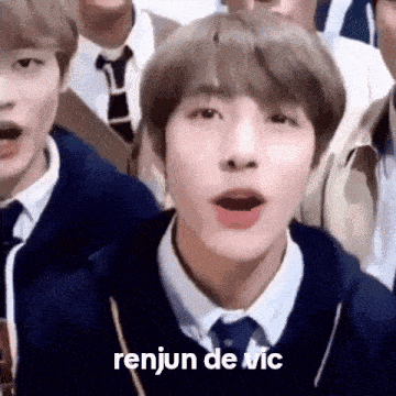 a close up of a person 's face with the words renjun de vic written on it .