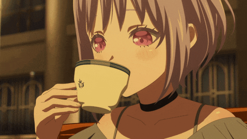 a girl with red eyes is drinking from a cup that has a crown on it