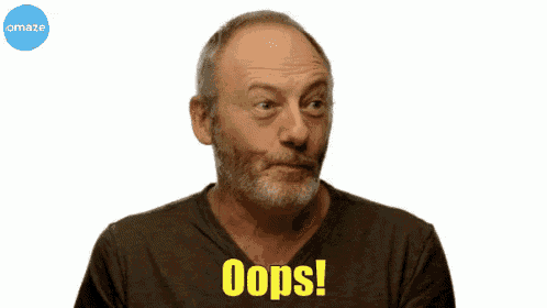 a man with a beard is holding his finger to his mouth and says oops