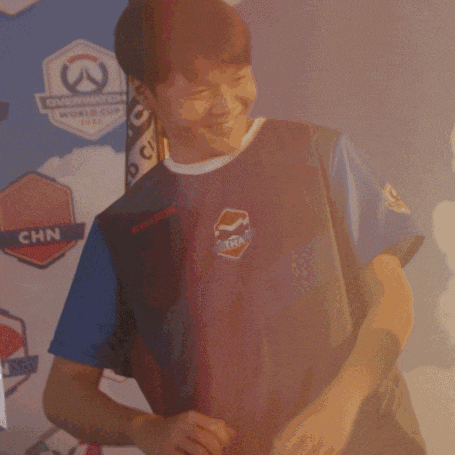 a man wearing a shirt with chn on it