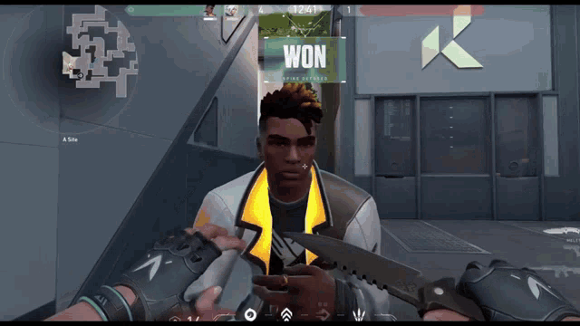 a man holding a knife in front of a sign that says " won "