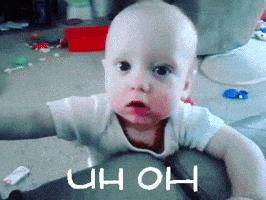 a baby is laying on the floor with the word uh oh written on the bottom
