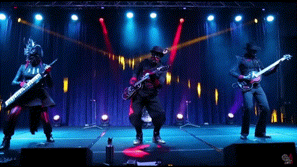 a group of people playing instruments on a stage