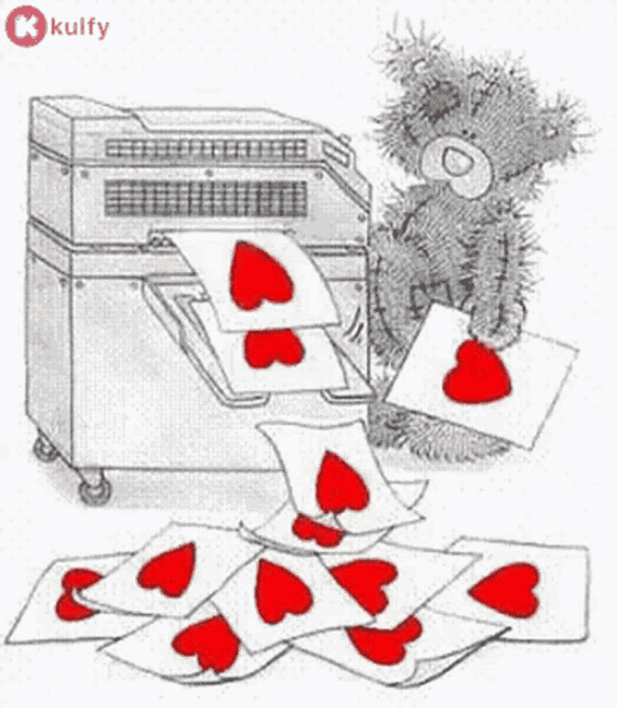 a teddy bear is standing next to a printer holding a piece of paper with a red heart on it .