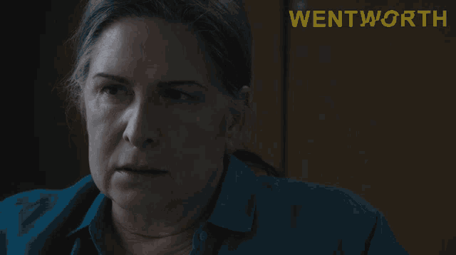 a woman says what 's in it for you in front of a poster for wentworth
