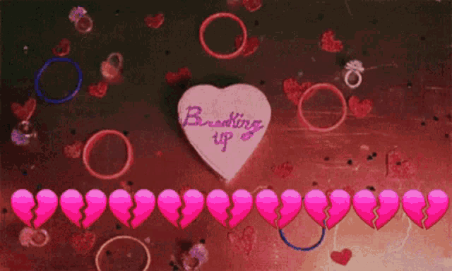 a person is holding a pink hammer next to a row of pink hearts .