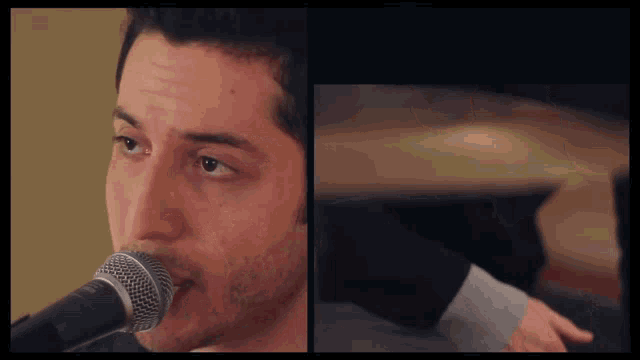 a close up of a man singing into a microphone with his eyes closed